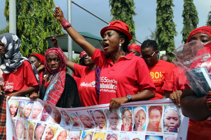 Members of the Bring Back Our Girls group campaigning for the release of the Chibok schoolgirls kidnapped by Boko Haram Islamists march to meet with the Nigerian president in Abuja, on July 8. / Philip Ojisua, AFP