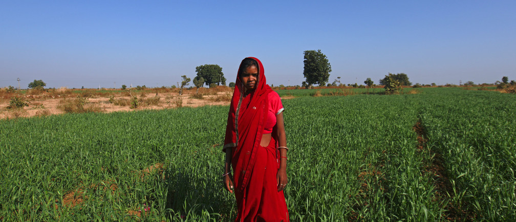 Child bride Krishna, 14, poses in a wheat field on the outskirts of her village. Image: REUTERS/Danish Siddiqui